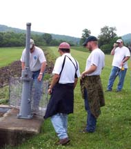 Inspection team evaluating a sluice gate.