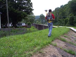 Inspector walking the levee crest.