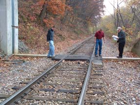 Inspection team evaluating a closure sill.